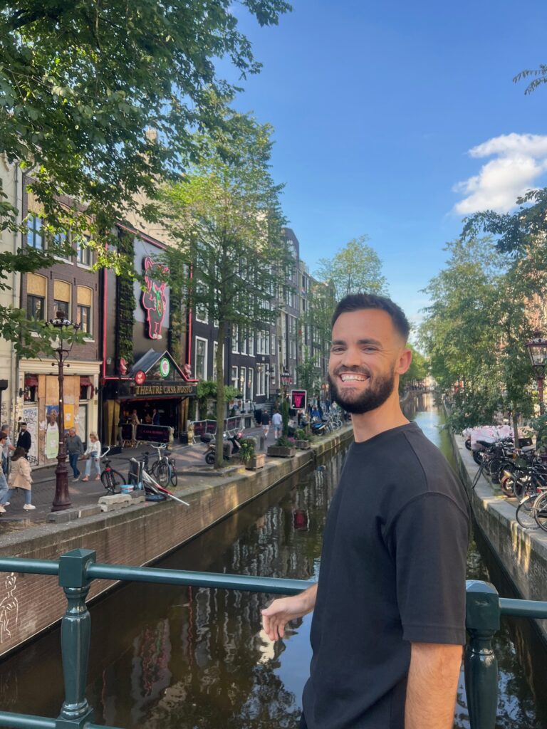 Smiling in front of Amsterdam canals